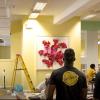 Crew installing artwork on university campus